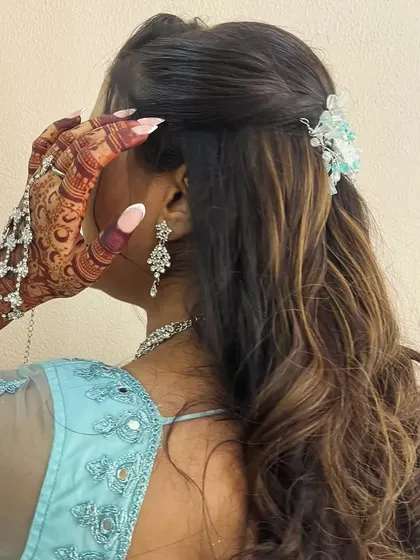 A close up of the beautiful henna stain, paired with gorgeous hair and jewelry. It's all about the complete look.