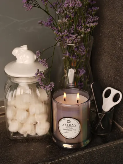A cozy corner in a home, made perfect with our Bengal Bamboo & Fig candle. The iridescent glass jar adds a touch of modern elegance to any decor.
