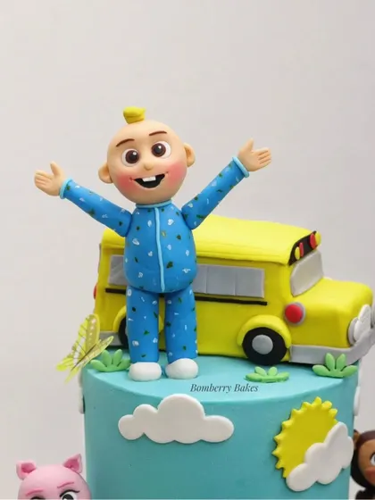 A vibrant Cocomelon-themed cake, a huge favorite with kids. This topper is a fully hand-sculpted JJ character standing in front of the iconic yellow school bus.