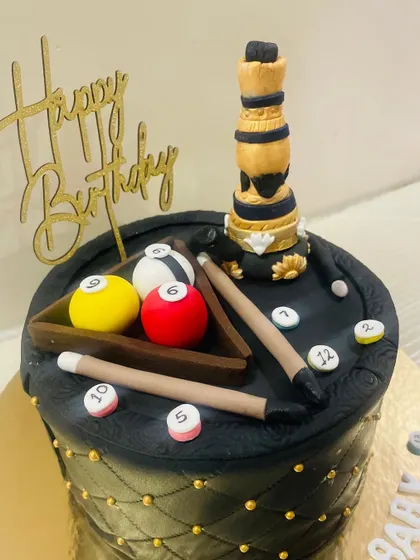 A close-up of the hookah and pool table cake, showing the detailed fondant work.