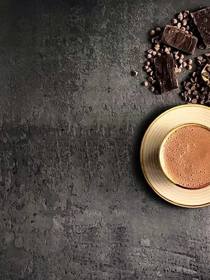 This is an example of my moody food photography style. Using a dark, textured background and directional light, I created a rich, comforting atmosphere for this hot chocolate shot, making you almost smell the cocoa.
