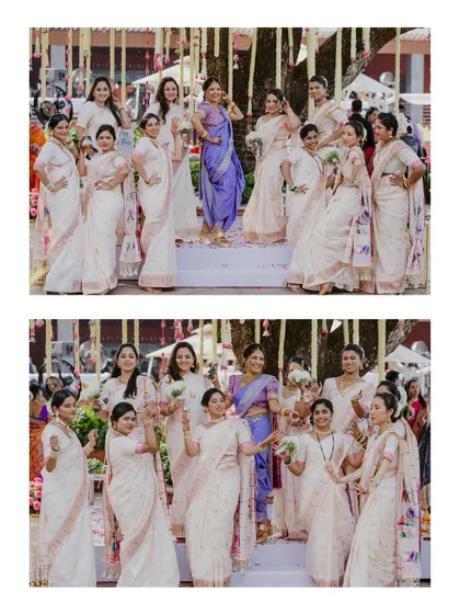 A group portrait of a Maharashtrian bride with her bridesmaids, who are all dressed in elegant matching white and pink sarees.