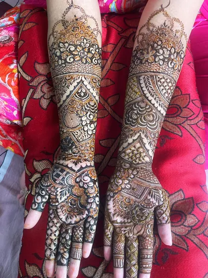 A full view of a bridal henna design with a mix of different patterns, creating a rich and detailed look.