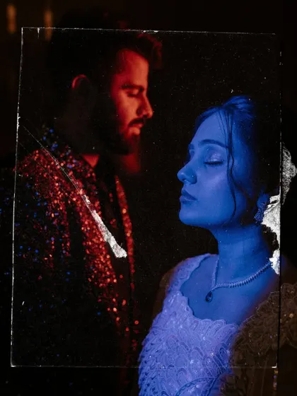An experimental double exposure portrait using red and blue light, turning a Sangeet photo into a piece of abstract art.