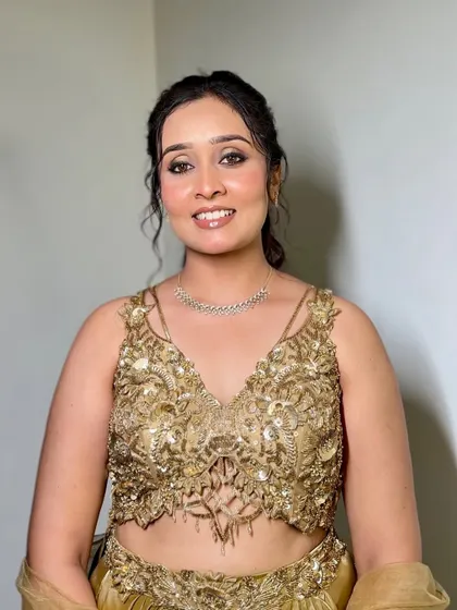 A soft and dewy look for this princess. The makeup is minimal yet elegant, with a focus on glowing skin and a simple hairstyle, perfect for a modern event.