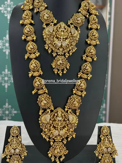 A classic Guttapusalu style necklace set with peacock and Lakshmi motifs, finished with pearl clusters.