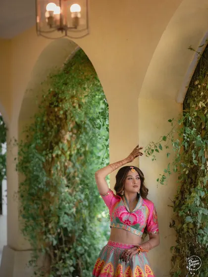 An artistic portrait of the bride, using the natural arches and vines of the venue to create a beautiful, painterly effect.
