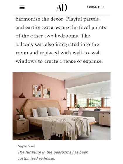 An Architectural Digest clipping mentioning the playful pastels and earthy textures of the bedrooms, where balconies were integrated to create a sense of expanse.