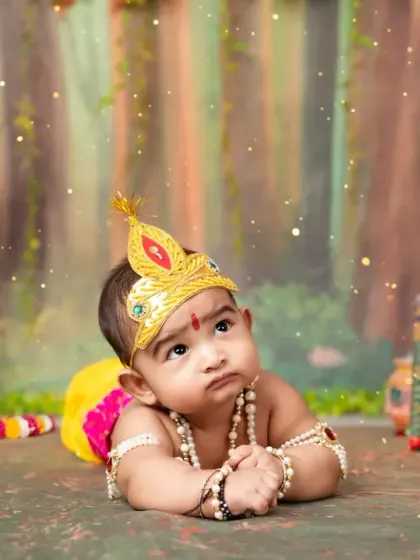 A beautiful tummy-time pose for our youngest Krishna, showing off his thoughtful expression.