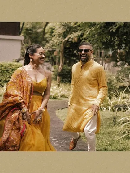 A candid, laughing moment between the couple post-Haldi.
