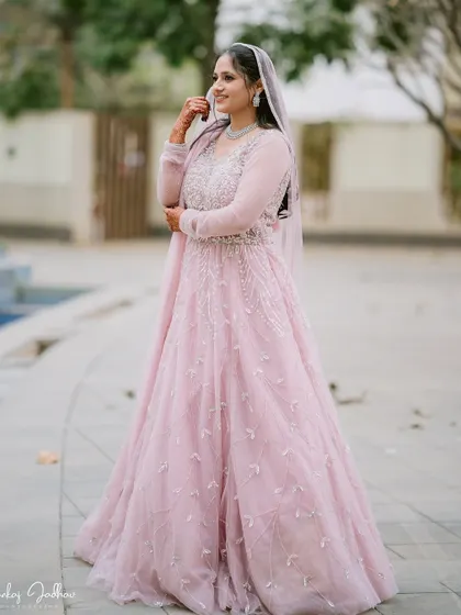 A full-length shot of Muskaan in her stunning pink engagement gown.