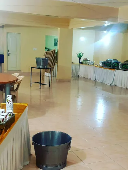An overview of a hall before guests arrive, showing my catering setup in place. I coordinate to have everything ready well before the event begins.