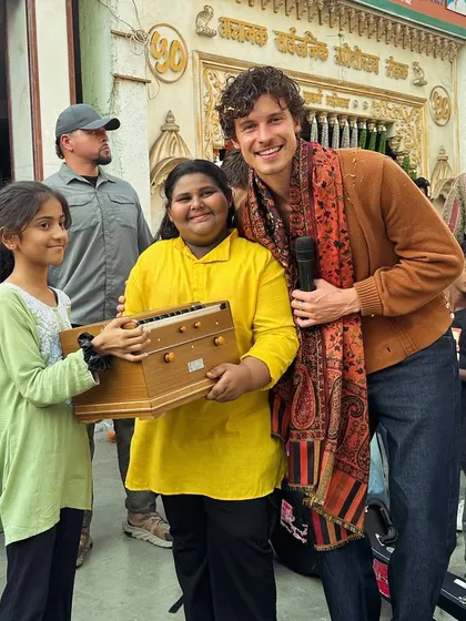 Our students presenting the harmonium to Shawn Mendes. This gift was made possible by the master craftsmen at Haribhau Vishwanath.