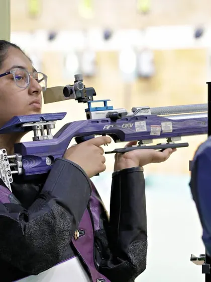 A shooter with her distinctive purple rifle, ready on the firing line. The diversity of athletes and equipment at my events shows the wide appeal and accessibility of the championships I organize.