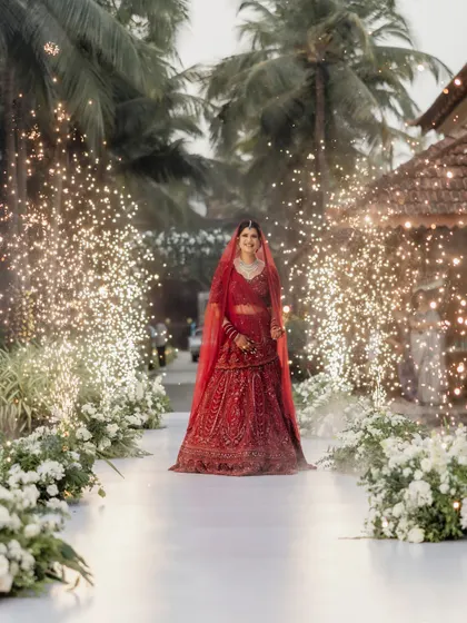 A bride's entry should be nothing short of magical. For this Goa wedding at Alila Diwa, we lined the aisle with sparklers to create a path of light for her grand entrance.