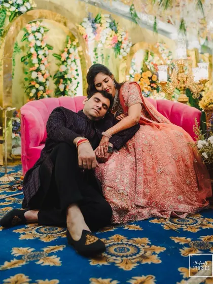 A tender moment with the groom resting his head on the bride's lap. This portrait is intimate, relaxed, and full of love.