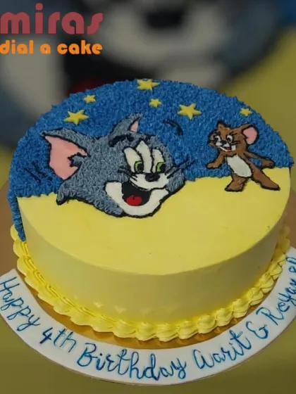 The classic chase is on with this fun Tom & Jerry cake. I used buttercream to create a playful scene with Tom's face and a tiny Jerry, perfect for celebrating a fourth birthday with a dose of cartoon nostalgia.