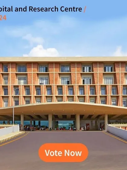 The grand entrance of the Symbiosis University Hospital and Research Centre, shortlisted for the LOOP Design Awards. The design features a commanding brick facade and a sweeping canopy, creating a welcoming gateway that reflects the institution's stature.