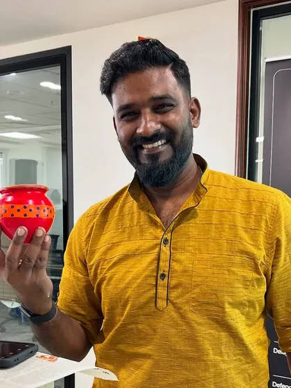 A happy participant with his beautifully painted pot. The sense of accomplishment is one of the best parts of any art workshop.
