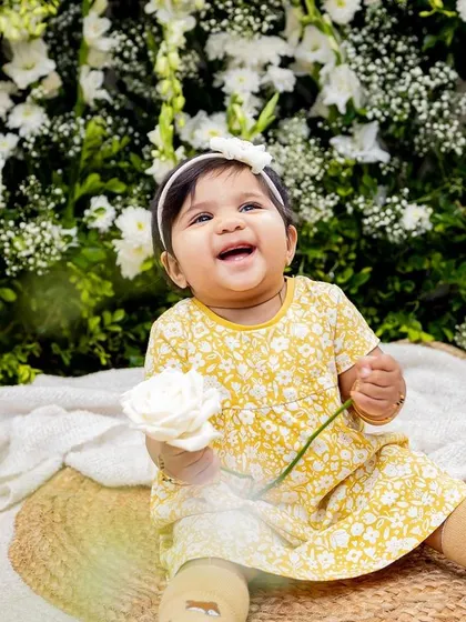 This little girl's joyful expression is the focus of this lovely black and white photo.
