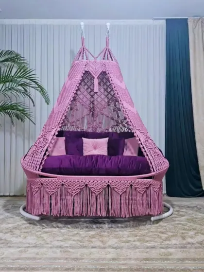 A beautiful pink and purple combination for a sofa-style swing. This piece stands on its own frame, making it easy to place in any room or covered patio area.