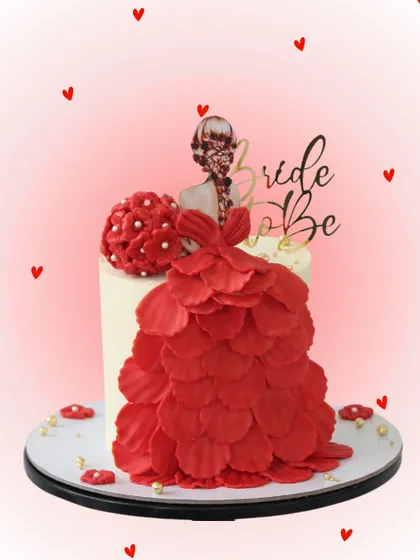 A chic and stylish cake perfect for a "Bride to Be" celebration. This design features an edible, handcrafted red gown with intricate petal details, making it a fashionable and delicious centerpiece for a bridal shower.