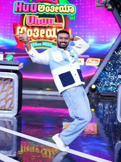 Striking a dance pose on the colorful stage of a Star Suvarna festival special. The energy of a live audience is the best.