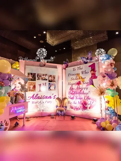 A storybook-themed photo area, featuring a giant open book with a heartfelt message, a whimsical cart, and princess cutouts for an imaginative touch.