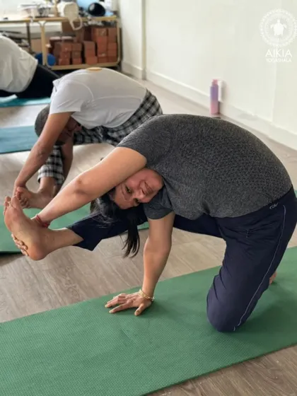 Another student attempts a variation of Vishvamitrasana, showing that the journey to mastering a pose involves different stages and modifications, all of which are explored in our TTC.