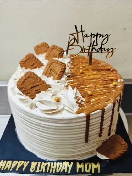 A delicious Caramel and Biscoff flavored cake I made for a client's mom. The combination of sweet caramel, spiced Biscoff, and creamy frosting is just perfect.
