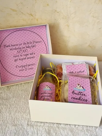 "Thank heaven for the little princess." This personalized baby girl announcement box is filled with our handmade goodies like butter cookies and date & walnut cake.