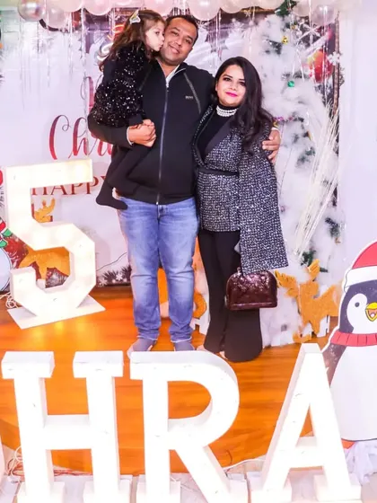 A family portrait from a Christmas-themed 5th birthday party. I provide beautiful, themed backdrops that are perfect for capturing memories with your loved ones.