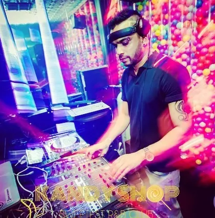 A motion-blurred shot capturing the fast-paced energy of a Friday night set. I'm in my element, mixing tracks on my Pioneer DJ setup.