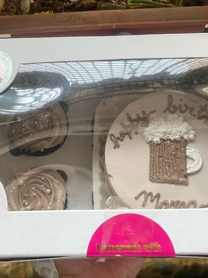Can't decide between a cake and cupcakes? Get both. This combo features a bento cake with a cute beer mug design and two matching chocolate cupcakes.