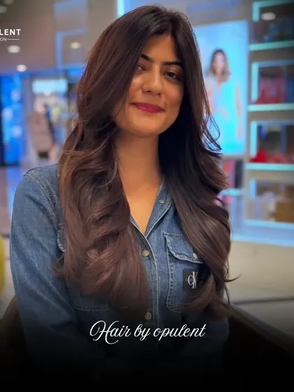 This transformation showcases how a good cut can completely change your look. The new layers add volume and a healthy bounce to her hair.