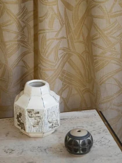 The 'Ami' semi-sheer fabric by Nobilis, woven from 100% hemp. Its intricate pattern, inspired by Japanese bamboo basketry, pays tribute to artisanal heritage and adds a layer of textured elegance to the window.