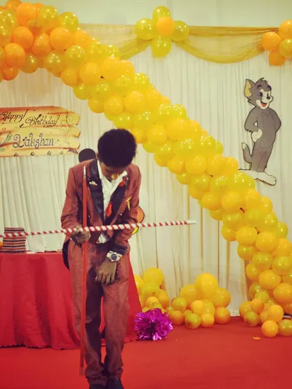 Performing the floating wand illusion at a colorful, cartoon-themed birthday party. I always tailor my performance to fit the theme and atmosphere of your special event.