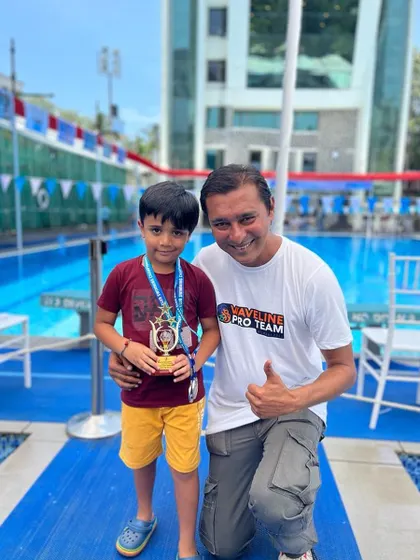 Celebrating another young champion's success. Our swimmer Divit Jain is pictured with his coach and runners-up championship trophy at the Juhu Gymkhana swim meet, where he won medals in freestyle and butterfly.