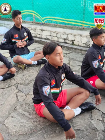 A close up of a player deep in meditation. The ability to focus and shut out distractions is a skill we cultivate, which translates directly to better performance on the field.