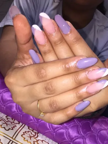 Another angle of the lilac V-French gel extensions, showing how the sharp lines elongate the fingers and create a very chic look.