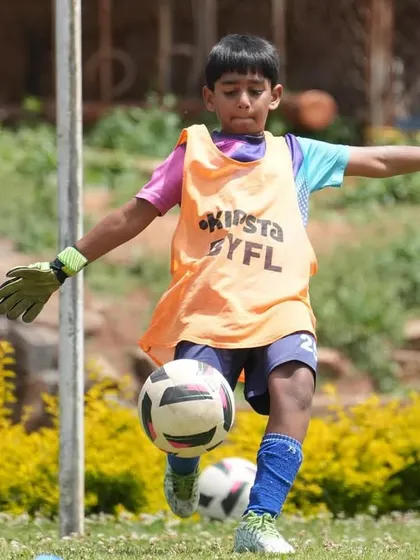 A goalkeeper practices his footwork, showing the dedicated training that happens even during our tours.