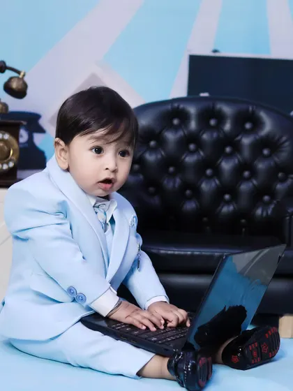 A close-up of our 'Boss Baby' hard at work on his laptop. These humorous, themed shoots are always a hit.