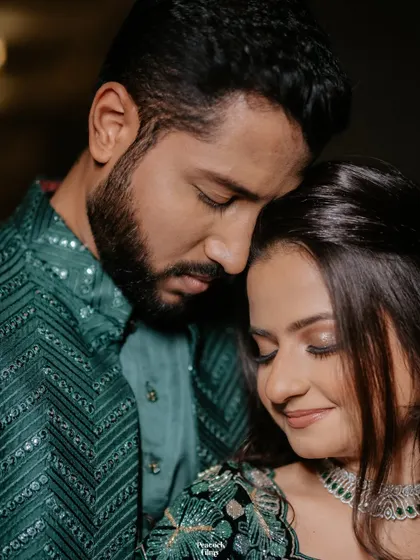 An intimate close-up of the couple, their foreheads touching. This portrait captures the deep connection and quiet love they share.