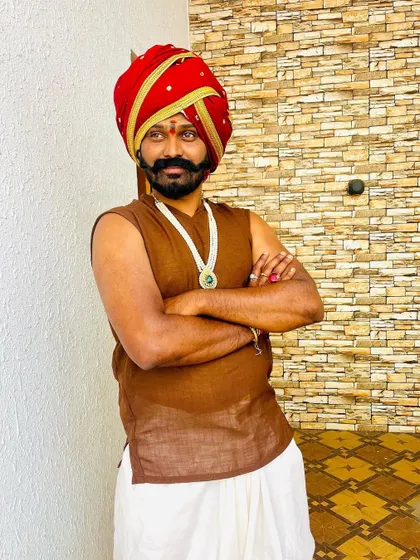 In costume for a skit on 'Gichchi Giligili', portraying a character in a traditional 'peta'.