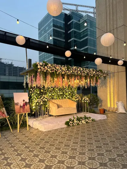 A wider view of the rooftop engagement stage, showing the setup in context with the city skyline. I also included easels to display the couple's photos.
