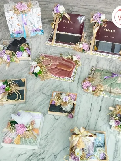 An overview of a complete trousseau packaging project in a purple and white theme, showcasing how we coordinate everything from large boxes to small accessories.