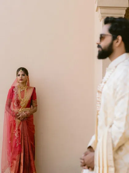 An artistic shot of the bride and groom, capturing a sense of anticipation and romance. My photography style often plays with composition and perspective to create visually interesting images.
