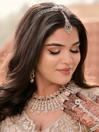 A close-up of this morning bride's soft and ethereal makeup. The focus is on clean skin and subtly defined eyes.