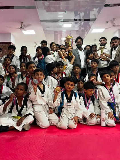 A proud moment for the entire team. My students, young and old, showing off their hard-earned medals and the team trophy. Every single win is a team effort.