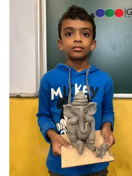 A young participant from our Indoscots Global School workshop with his beautifully crafted Ganpati idol. We focus on teaching the fundamentals of sculpting in an easy-to-understand way.